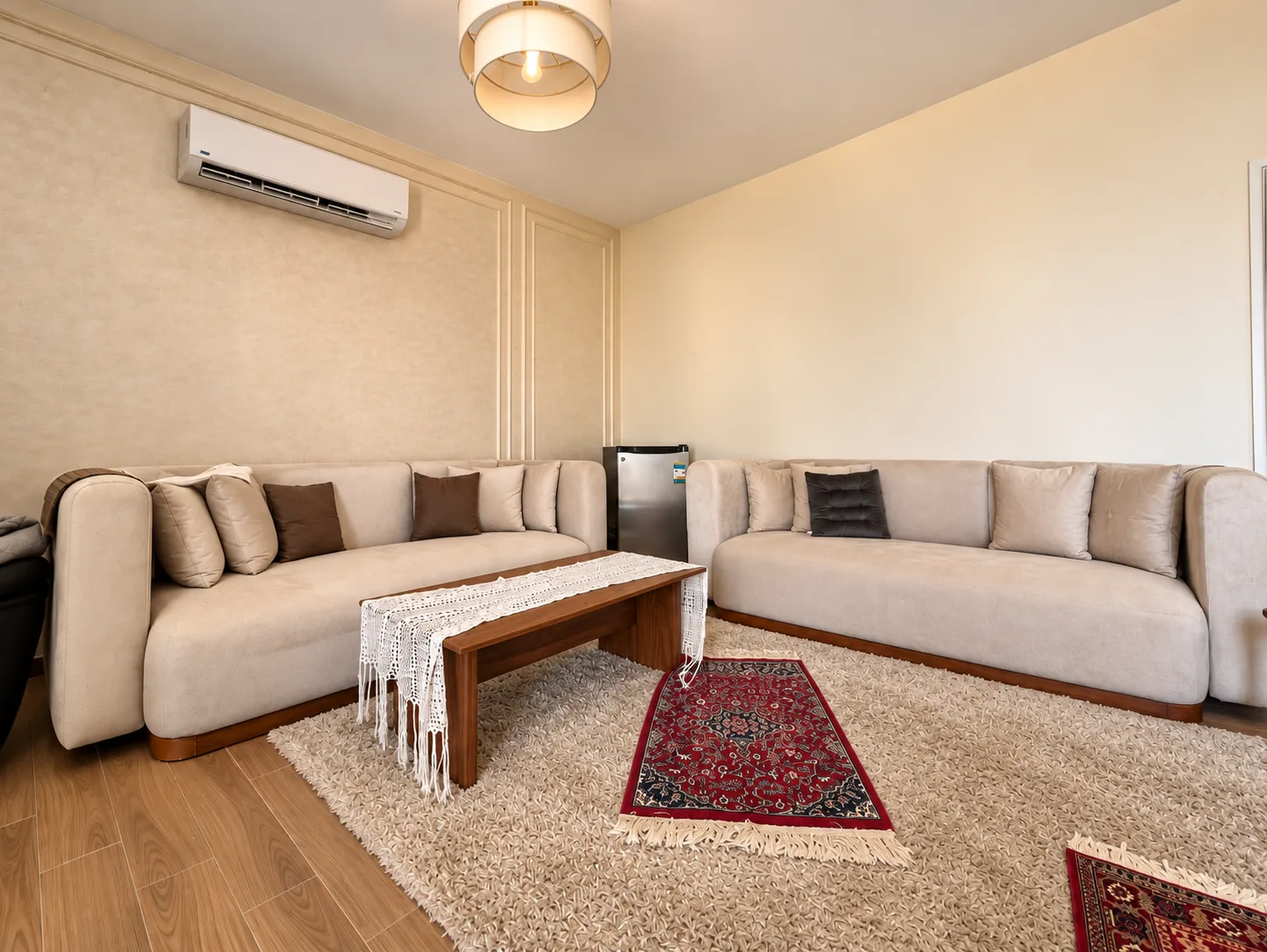 A photographed villa interior spanning the living room, two kitchens, bathrooms, fitted wardrobes and a home office.