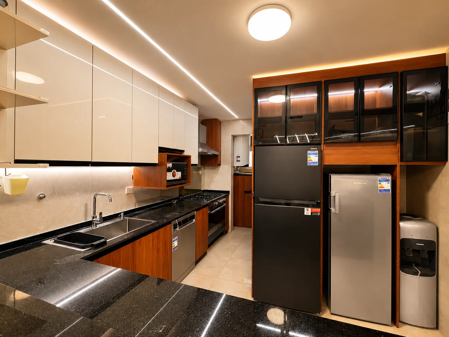 The finished kitchen, TV wall and bathrooms place cabinetry and durable surfaces at the centre of the work.