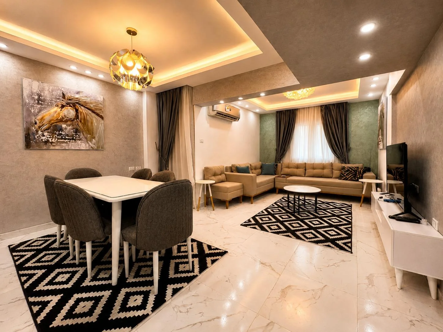Fitted wardrobes and timber-toned cabinetry shape the kitchen, bedrooms and shared rooms at Degla Palms.