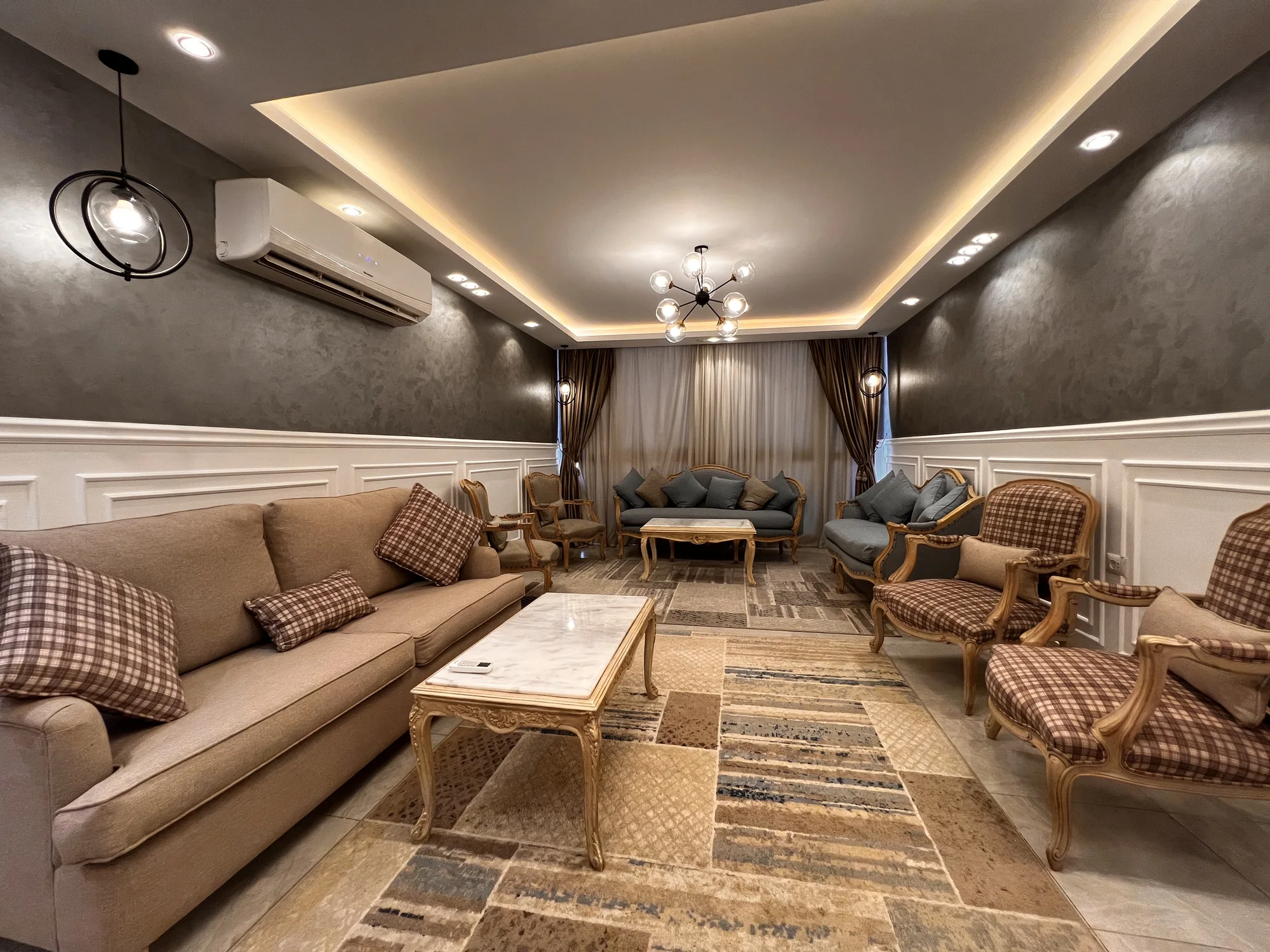 Warmly lit living room at One Kattameya