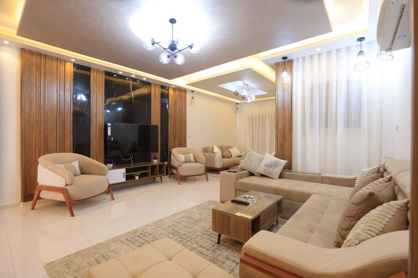 A bright kitchen and light cabinetry carry Villa 225's calm palette into its living and private rooms.