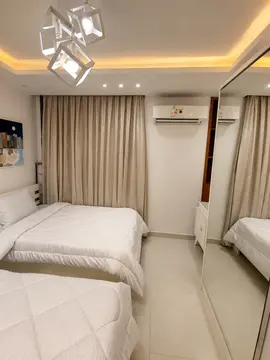 Bedrooms and Closets: bedroom with warm ceiling light and fitted furnishings (view 3)