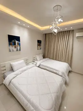 Bedrooms and Closets: bedroom with warm ceiling light and fitted furnishings (view 4)