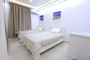 Bedrooms and Closets: light bedroom with curtains and fitted storage (view 6)