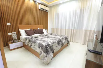 Bedrooms and Closets: bedroom with timber headboard and wardrobe (view 8)