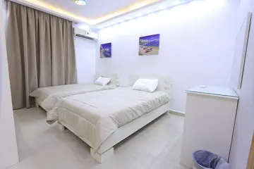 Bedrooms and Closets: light bedroom with curtains and fitted storage (view 11)