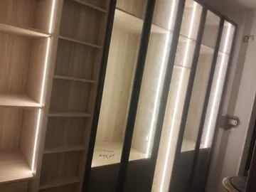 Dressing Room: illuminated dressing room cabinetry and glass doors (view 4)