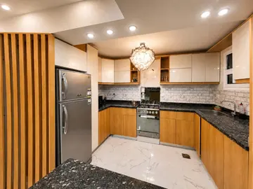 Kitchens: timber and light kitchen cabinets with a dining table (view 7)