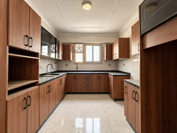Kitchens: long galley kitchen with timber lower cabinets (view 13)