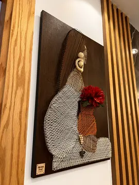 Timber Wall Cladding: vertical timber slats around wall art (view 2)